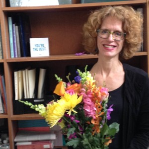 Pam Bristah receiving flowers from NEMLA. Photo courtesy of Kerry Masteller.