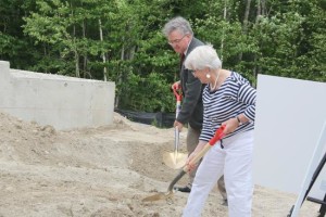 Whit Chapman, son of Bagaduce Music Lending Library co-founder Marcia Chapman, and Bagaduce Music Lending Library board president Ellie Horwitz, ceremoniously break ground. Photo by Monique Labbe 